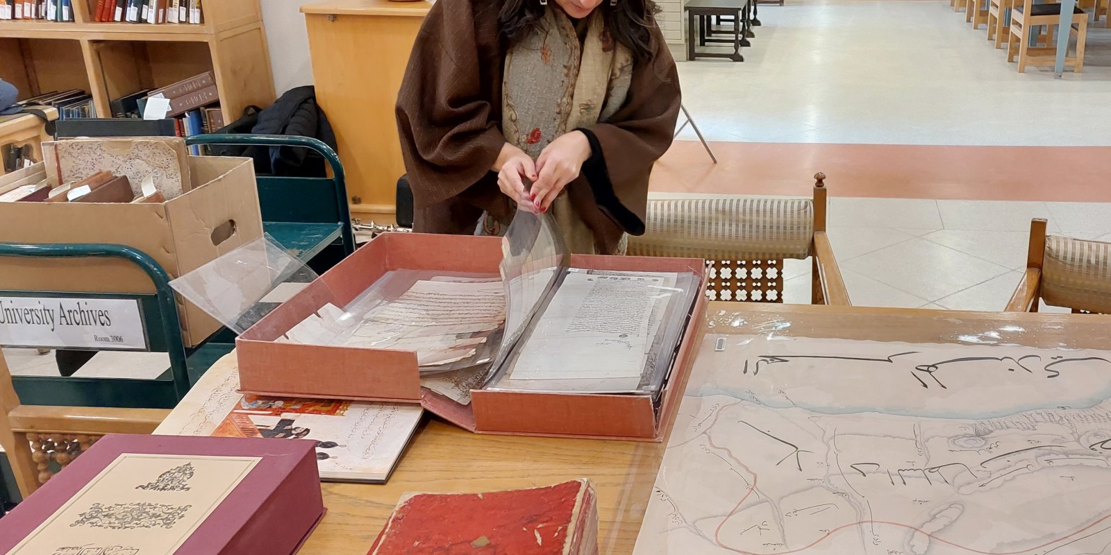 a student viewing rare books and manuscripts