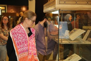 a visitor viewing a rare books and special collections library exhibtion